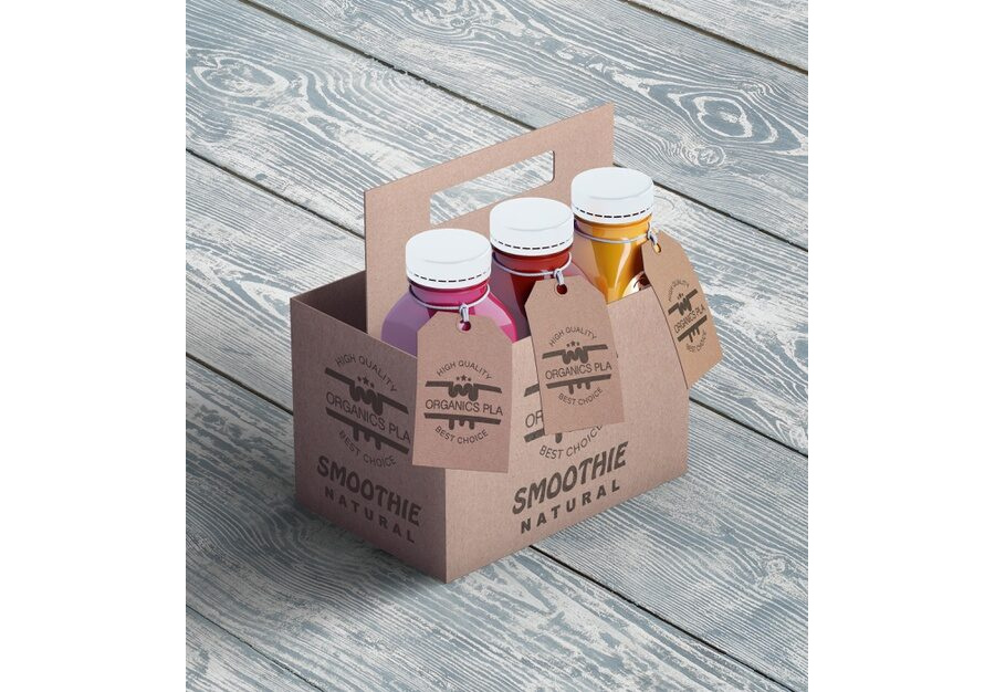 Plastic bottles of organic smoothie in cardboard boxes high view Free Psd