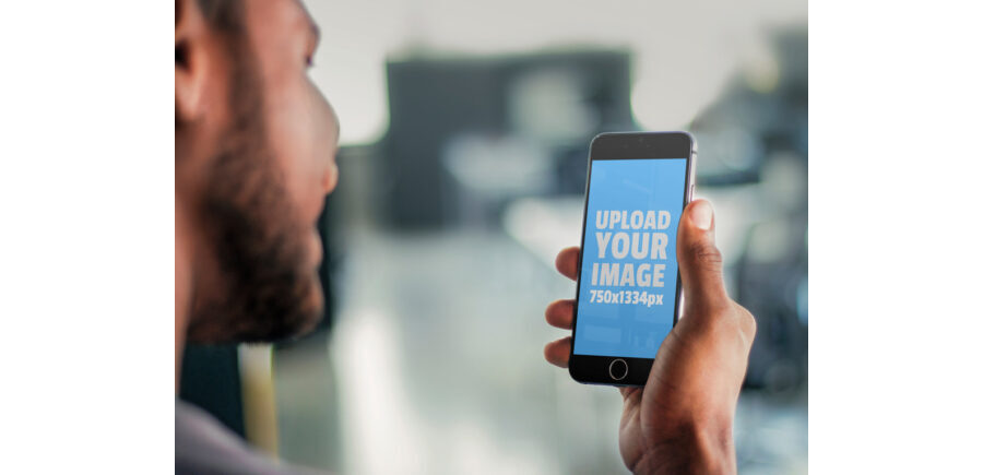 Man looking at black iPhone Mockup Generator